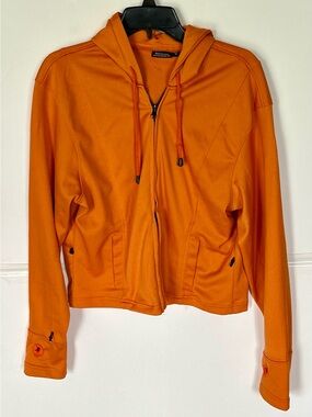 House of Leather woman’s LS orange hoodie with zip front and pockets. Size M